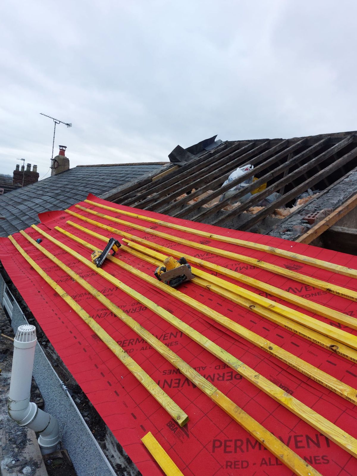 Fresh underlay and treated battens ready for slating